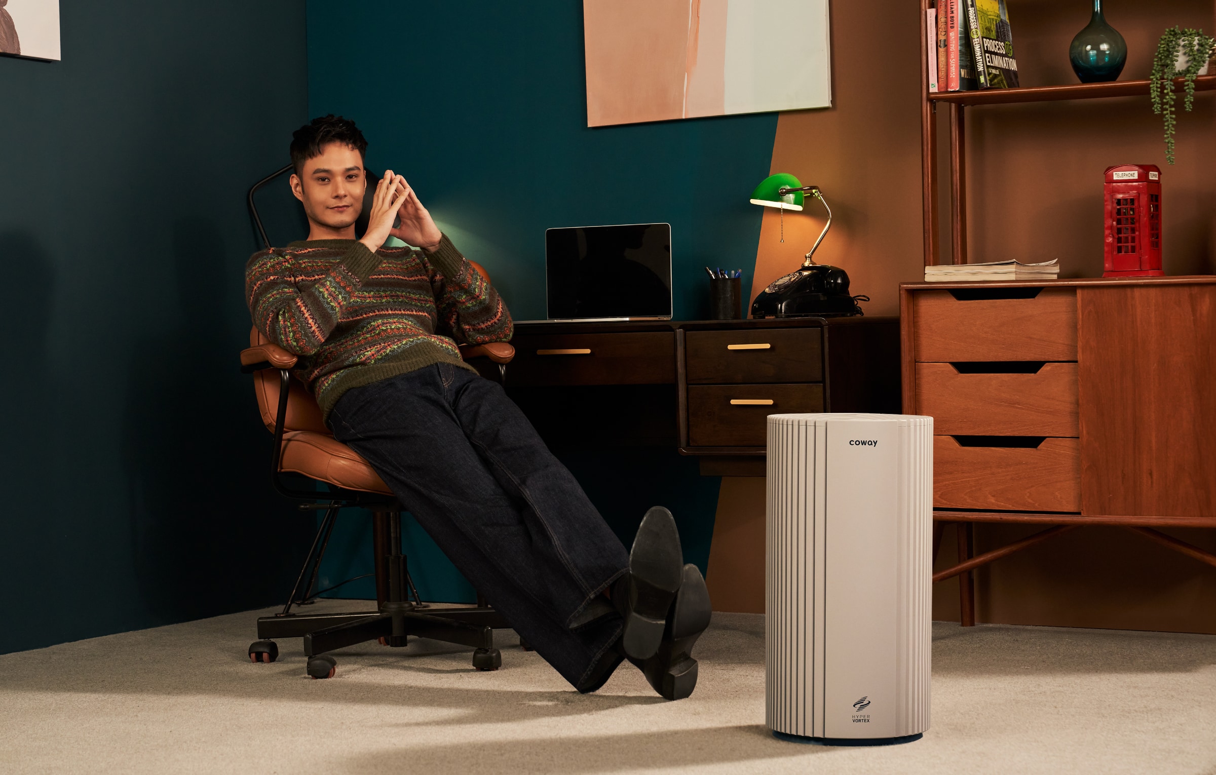 Coway Studio air purifier in a warm contemporary home office